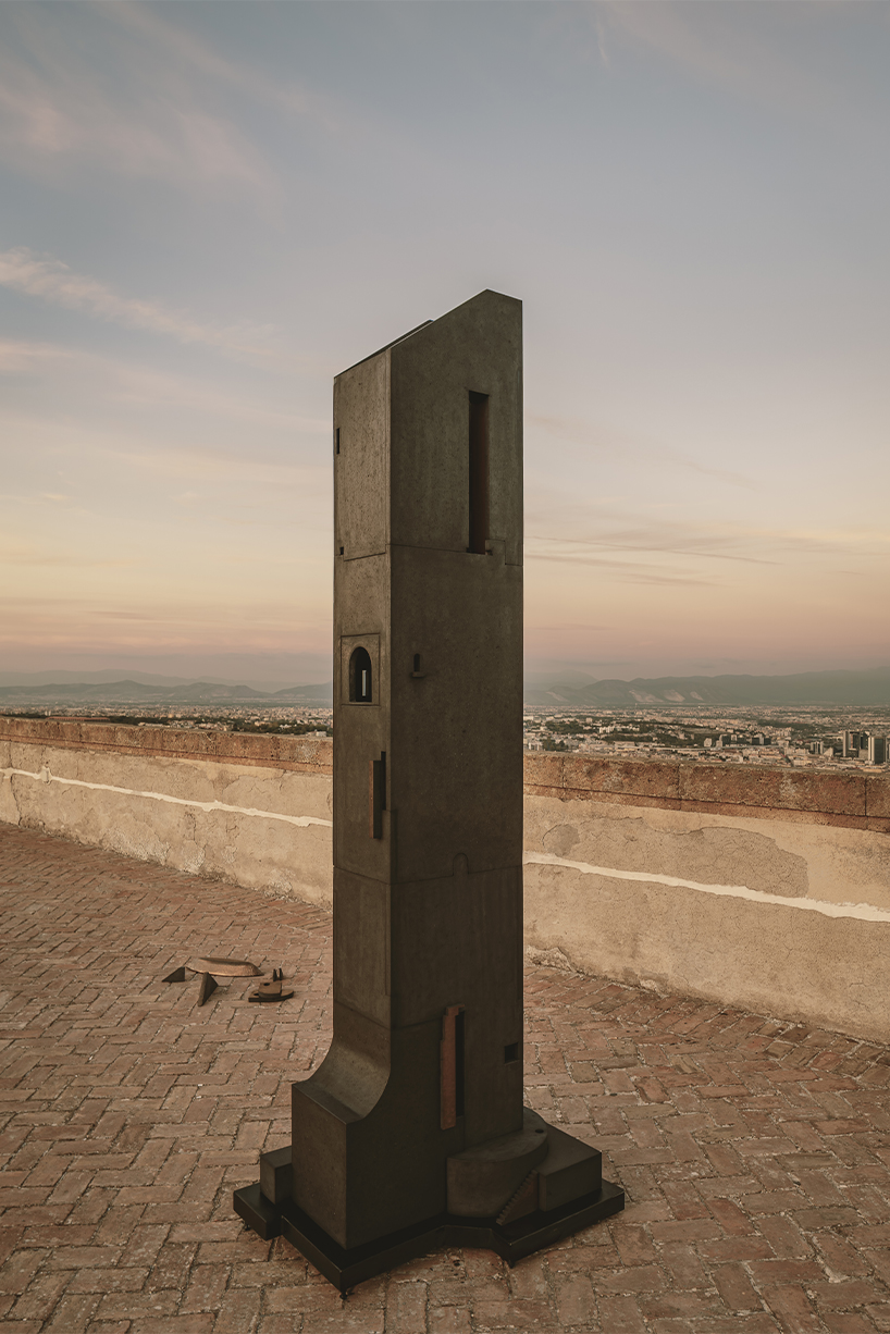 totemic sculptures compose volcanic stone landscape for site-specific installation in naples