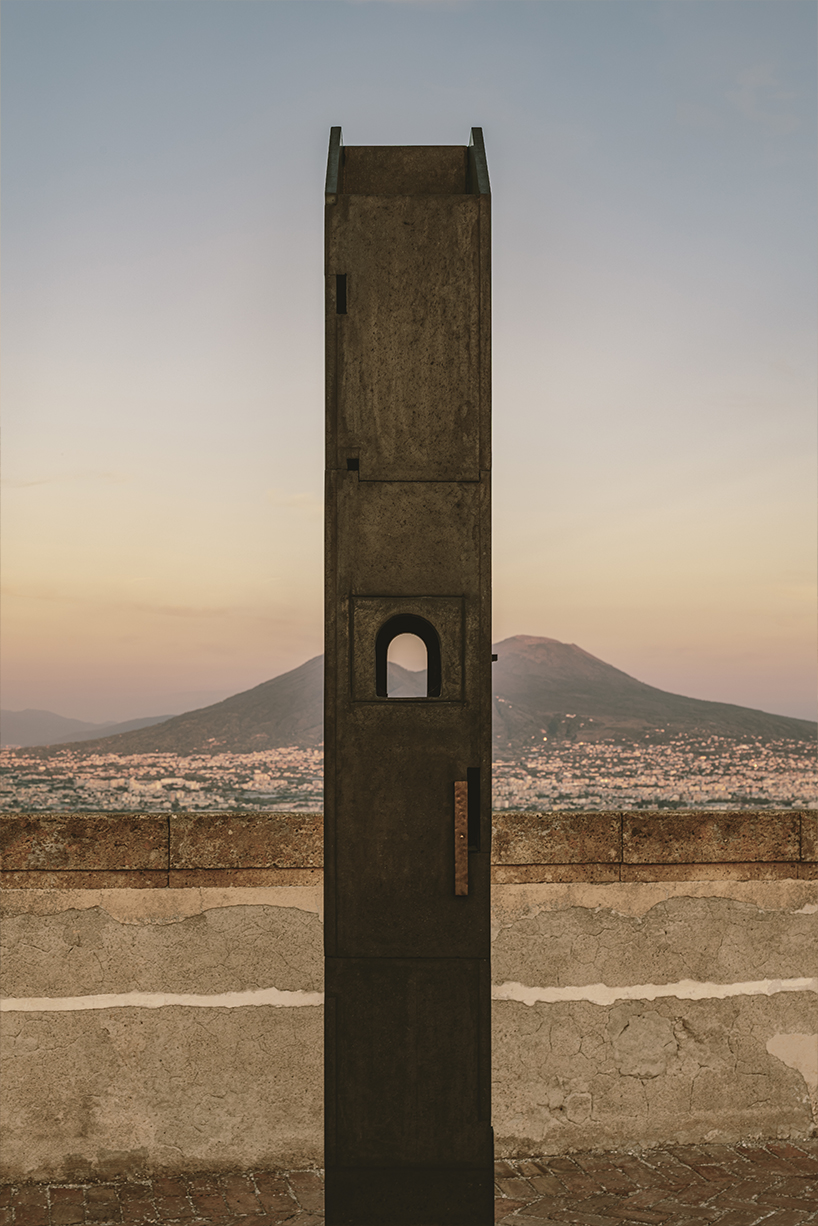 totemic sculptures compose volcanic stone landscape for site-specific installation in naples