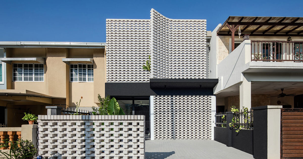 porous white brickwork facade enfolds renovated 1980s terrace house