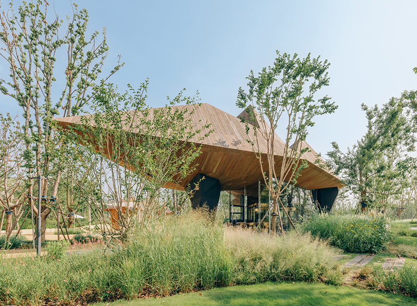 pyramidal volumes with wood strip patterns frame luxeisland restaurant by DL atelier