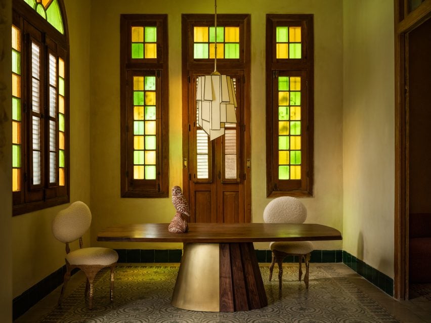 A room with stained glass windows featuring collectible designs by Anthony Guerrée, Chris Wolsten and Jason Koharik