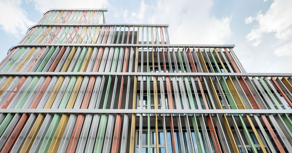 translucent facade of multicolored steel louvers unfolds along seoul’s market