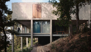 concrete columns lift residence among forest in georgia
