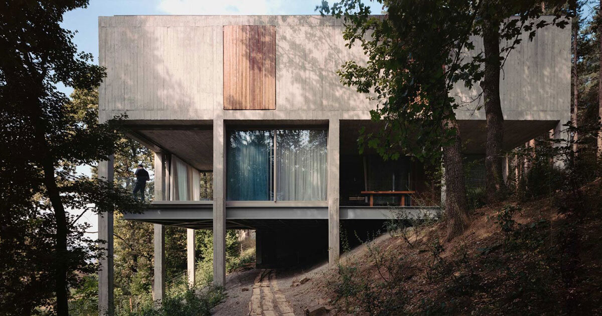concrete columns lift residence among forest in georgia
