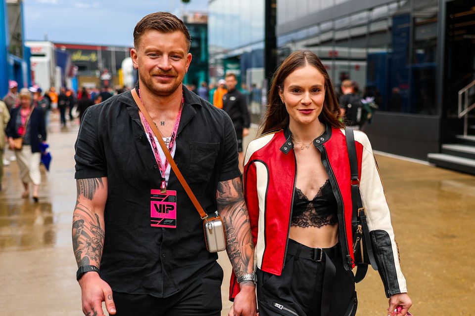Adam Peaty and Holly Ramsay walk in the paddock during the F1 Grand Prix of Great Britain at Silverstone Circuit on July 6, 2025 in Northampton, United Kingdom. (Photo by Kym Illman/Getty Images)