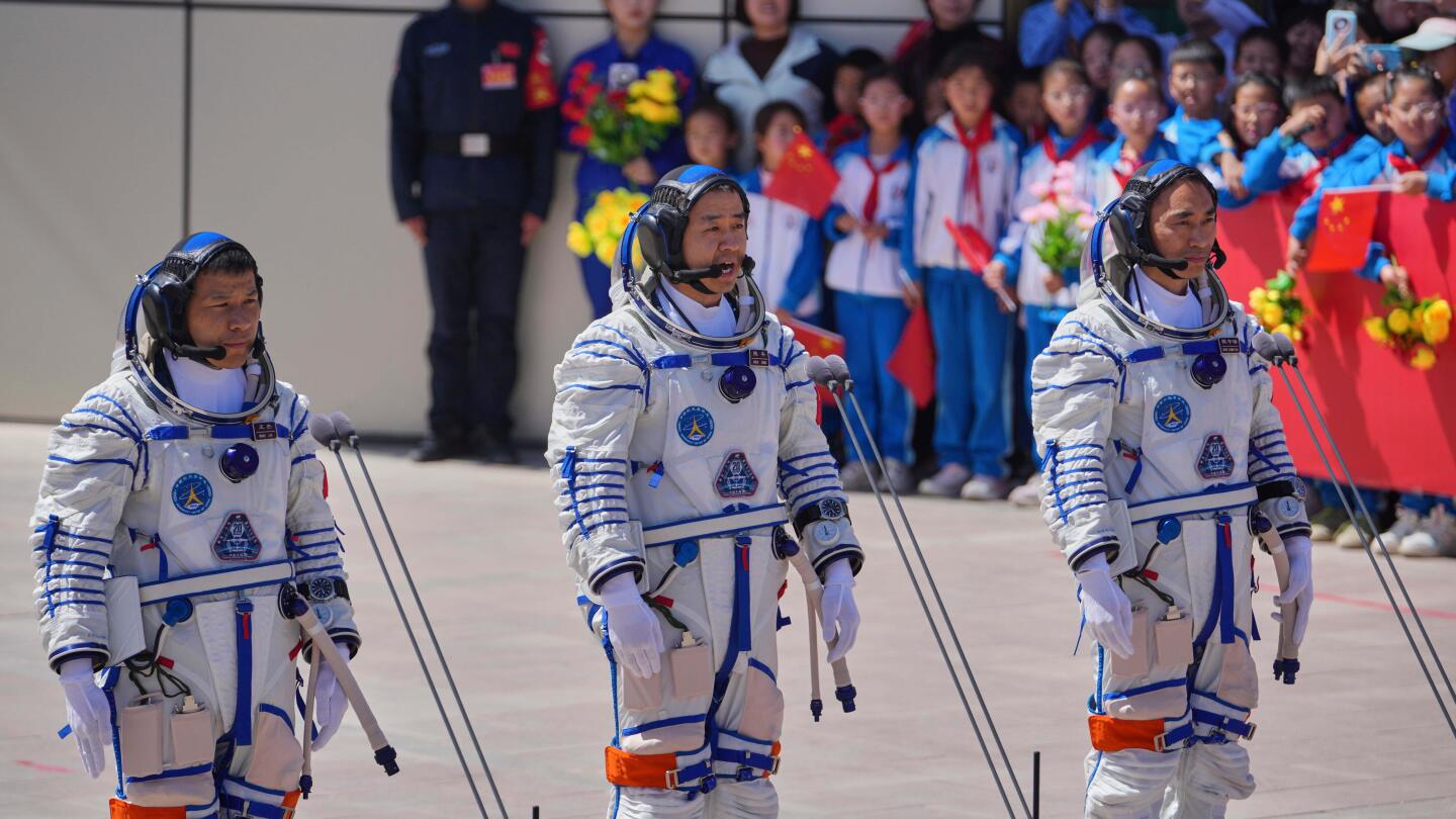 China's stranded astronauts 'in good condition' after space debris delays planned return