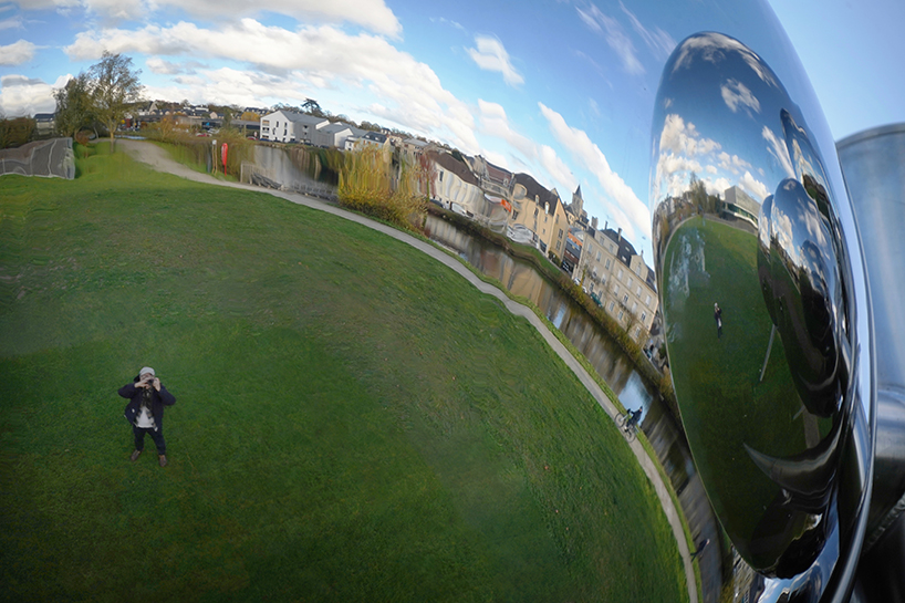 mirrored steel bubbles shape suspended kinetic sculpture by vincent leroy in normandy