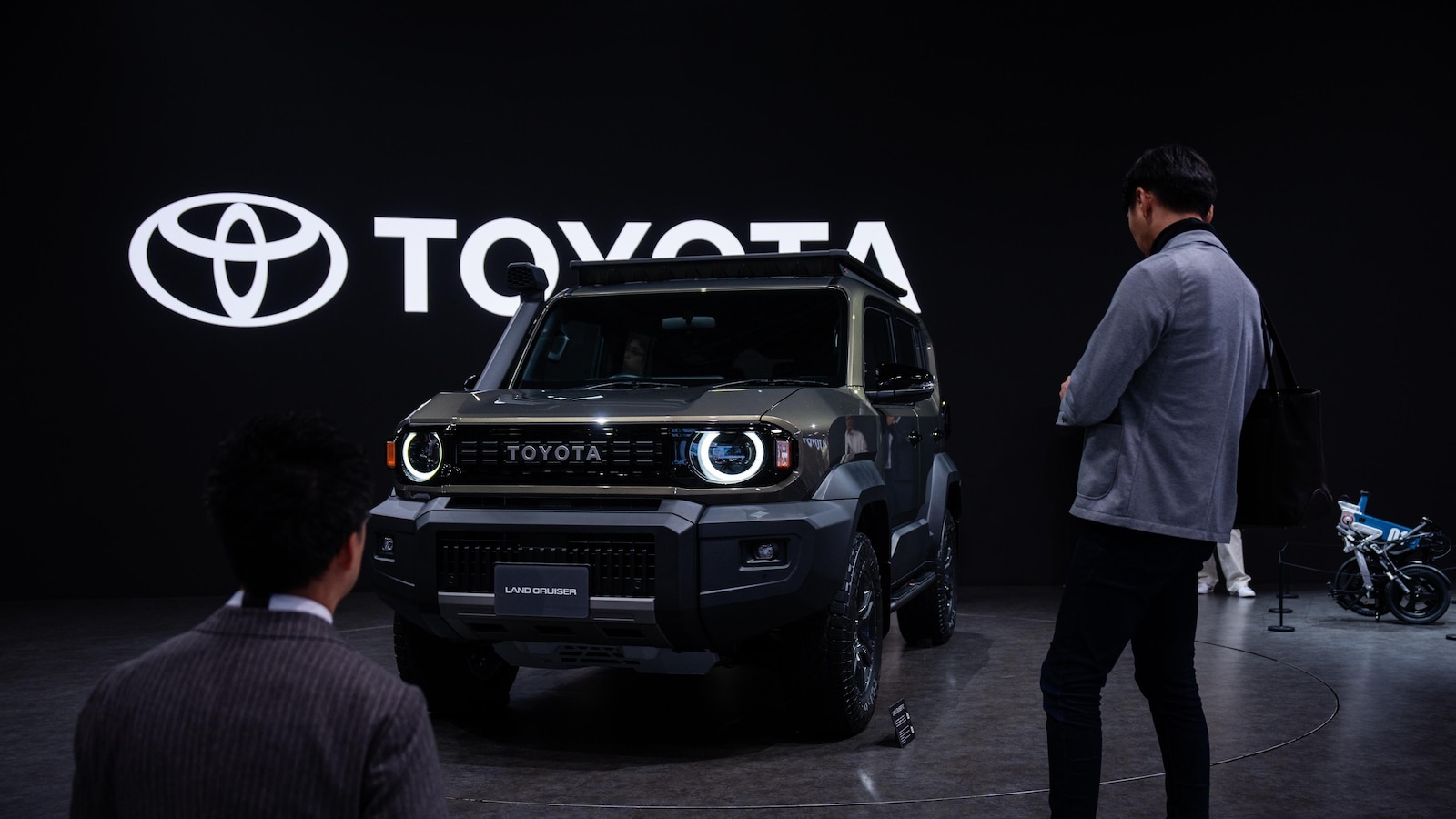 Japan's Toyota, hurt by President Trump's tariffs, reports a drop in profit