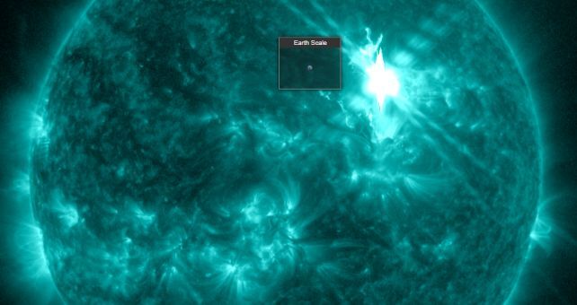 A glowing green image of the sun, with an extra-bright spot in the top right