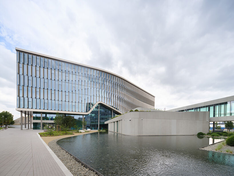 glass curtain wall envelops richter gedeon’s headquarters by ZDA in budapest