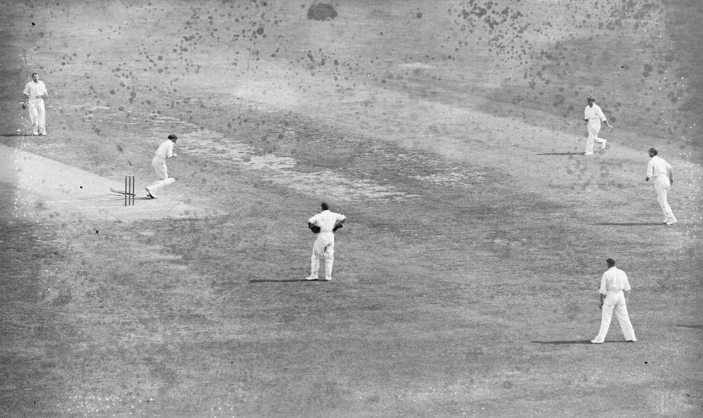 Australian captain Bill Woodfull clutches his chest and staggers from the wicket after being hit by English bowler Harold Larwood.