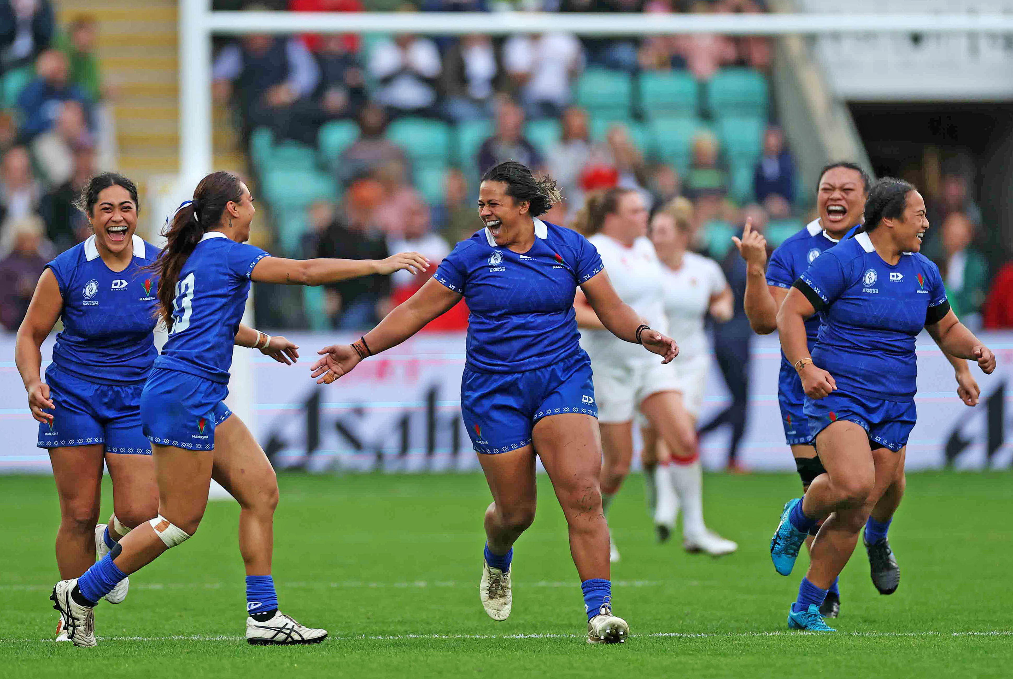 Harmony Vatau of Samoa scores a penalty and celebrates with teammates.