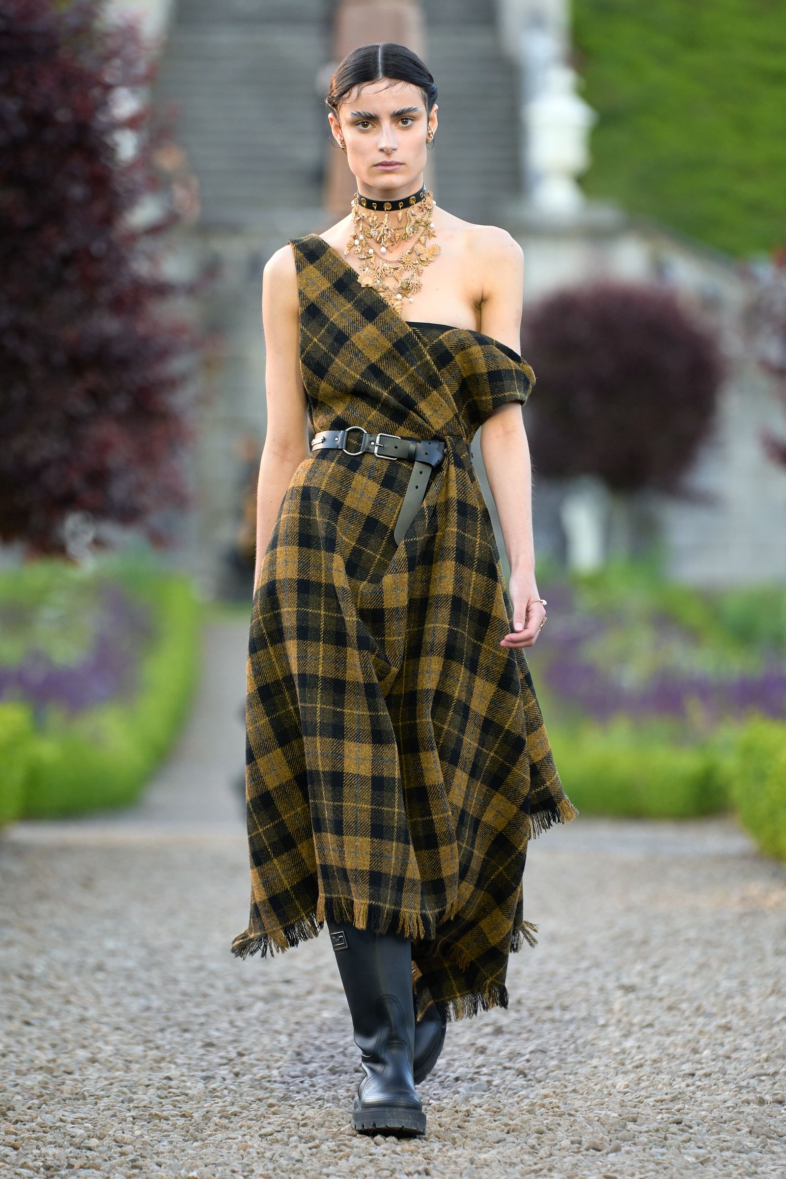 Image may contain Person Adult Clothing Footwear Shoe Accessories Jewelry Necklace Belt and Tartan