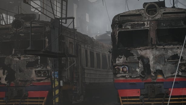 Damaged trains stand amid debris at a railway station depot hit by Russian shelling in Fastiv, Kyiv Oblast, Ukraine