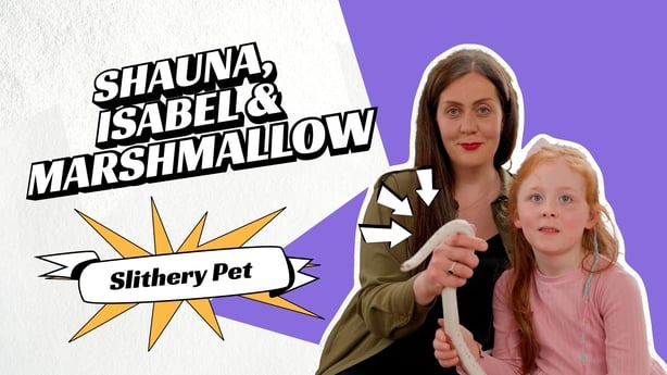 A graphic poster with the words Shauna, Isabel and Marshmallow and a mother and daughtert holding a white corn snake