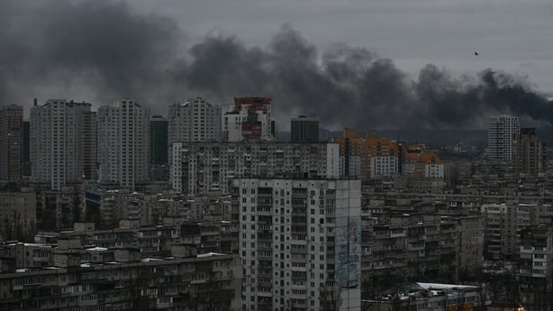 smoke rising above residential buildings following Russian drones and missiles attack, in Kyiv