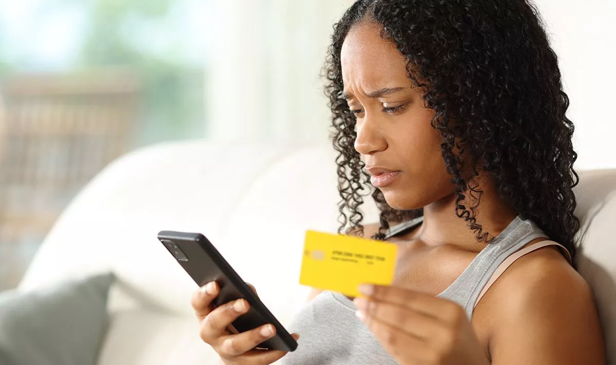A woman checks her bank account
