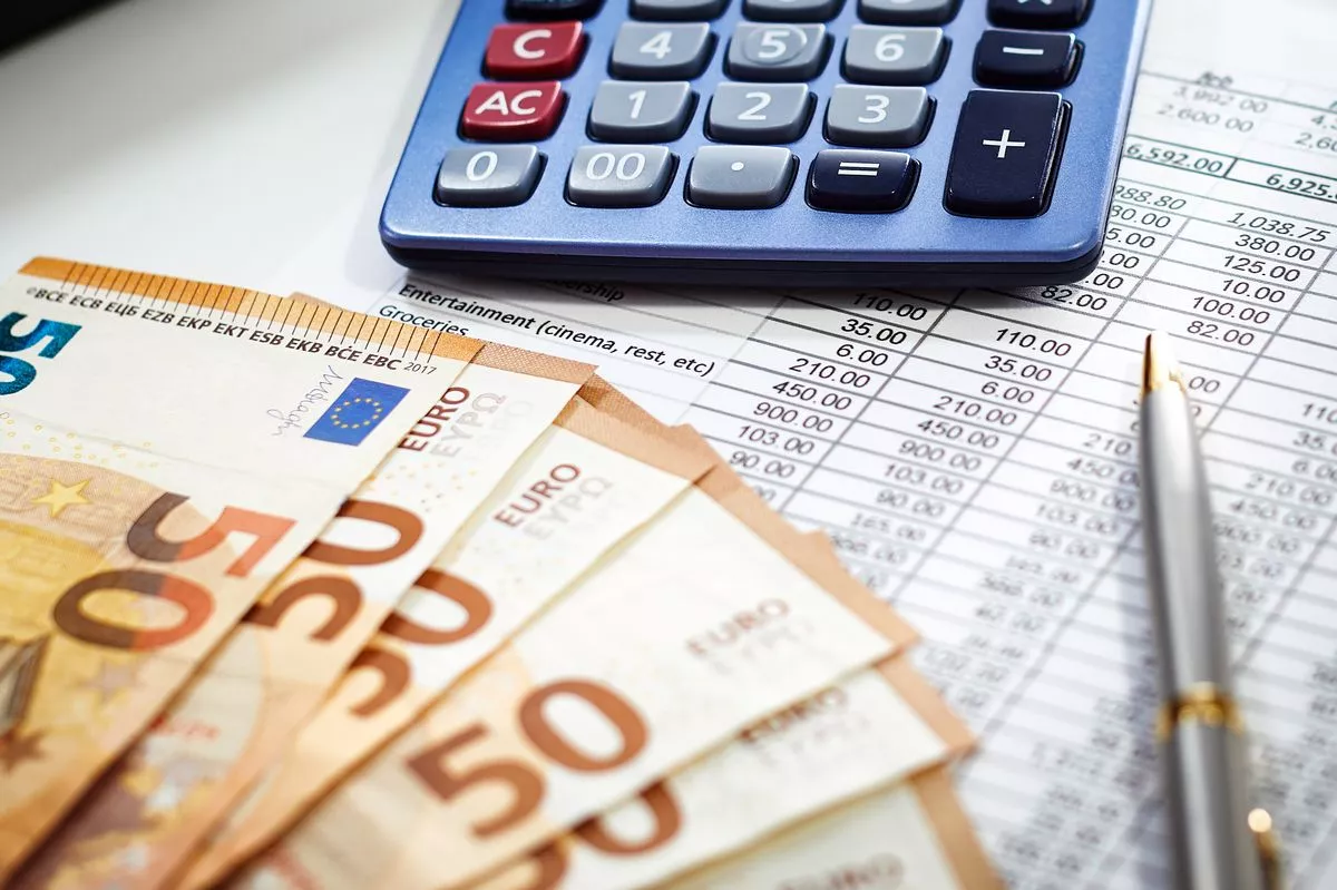 European Union currency with calculator, accounting concept, money, business, taxes, monthly expenses and personal finance, financial planner sheet