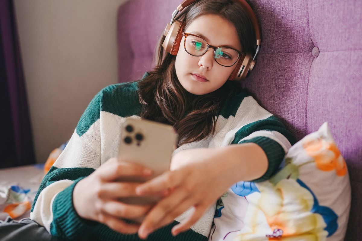 Girl resting in her bedroom (stock)