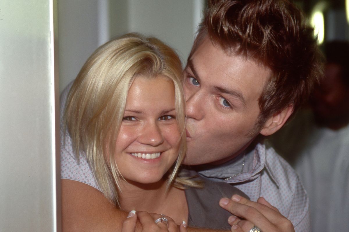 Singer and TV presenter Kerry Katona with Westlife member and husband Brian McFadden, London, circa 2002. (Photo by David Tonge/Getty Images)