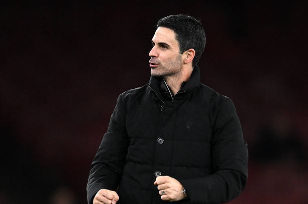 Arteta walking on the touchline.