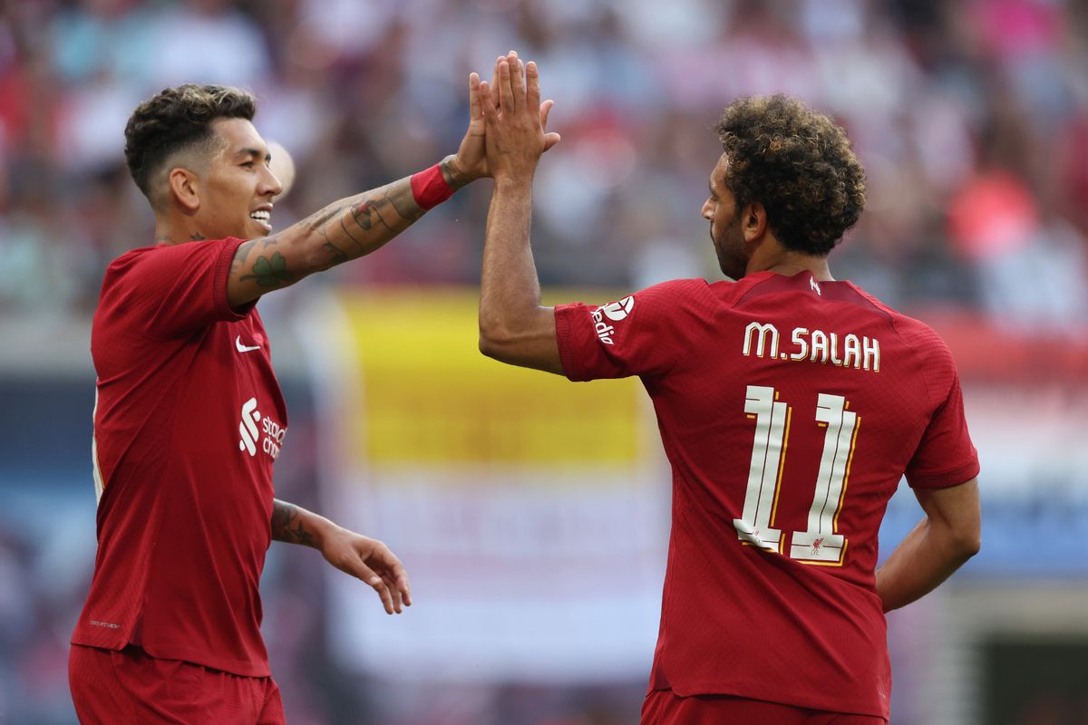 Mohamed Salah celebrates with Roberto Firmino of Liverpool after scoring their team's first goal during the pre-season friendly match between RB Leipzig and Liverpool FC.