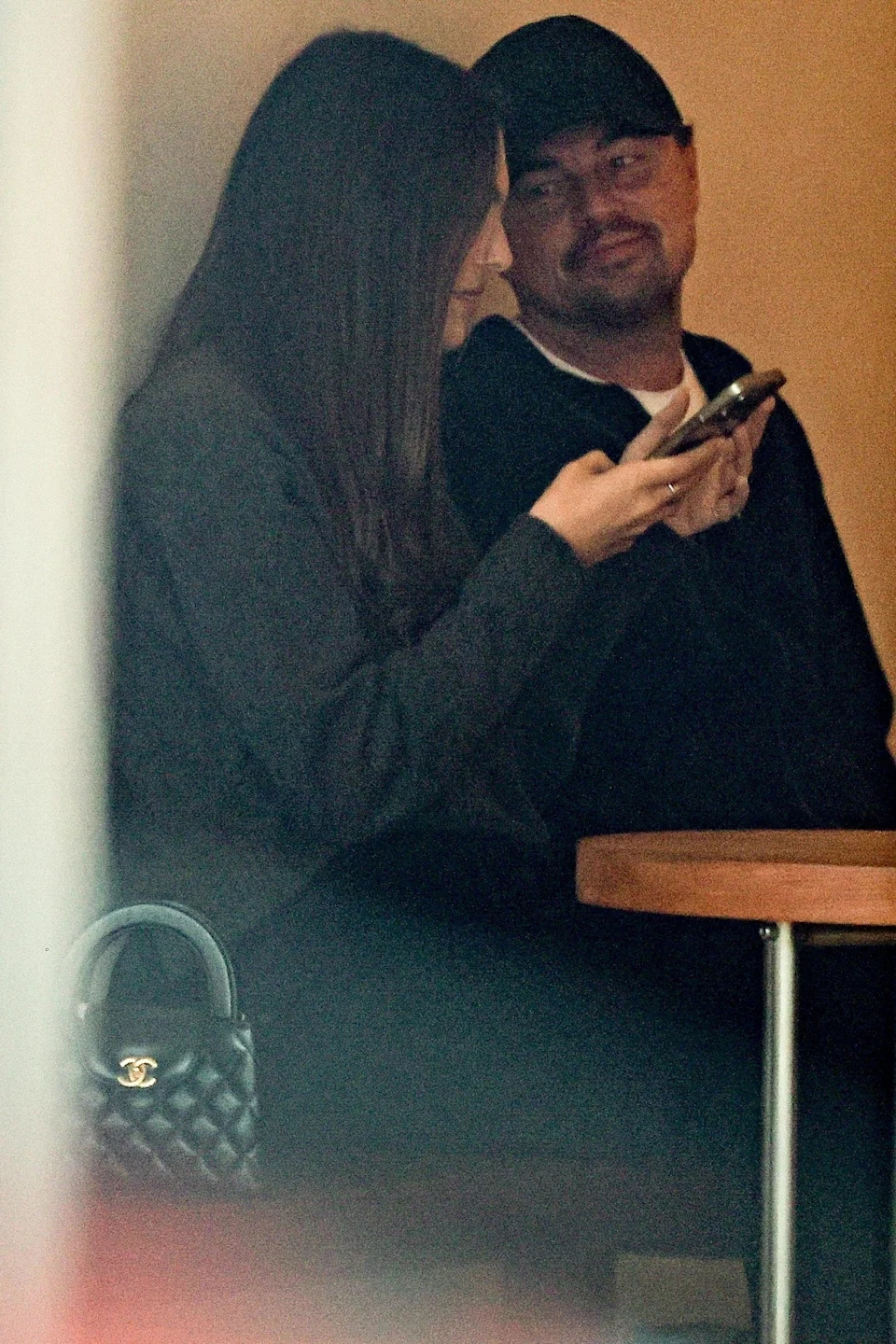 Ceretti checked her phone while DiCaprio looked on. SPOT / GAMR / BACKGRID