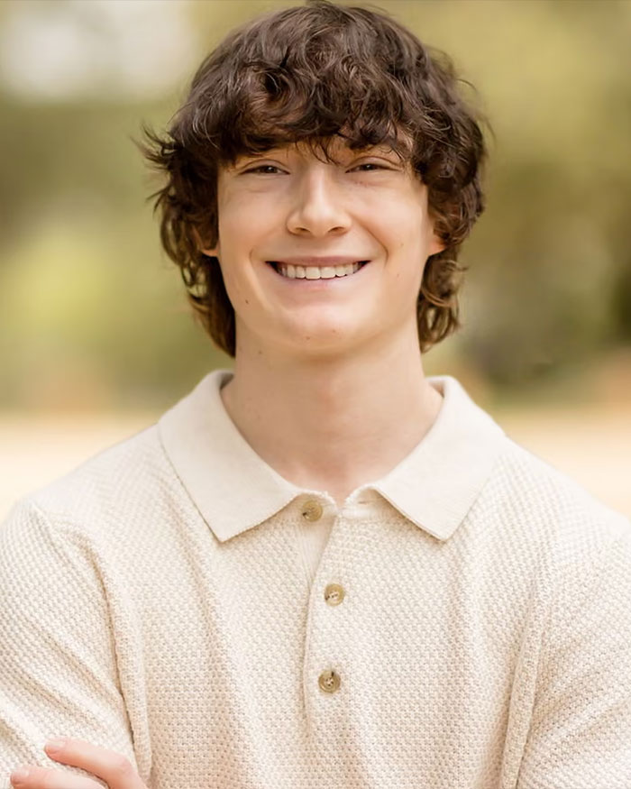 Smiling teenage boy outdoors wearing a cream textured polo shirt, linked to ChatGPT and expert reactions after teen loss news. Smiling teenage boy outdoors wearing a cream textured polo shirt, linked to ChatGPT and expert reactions after teen loss news.