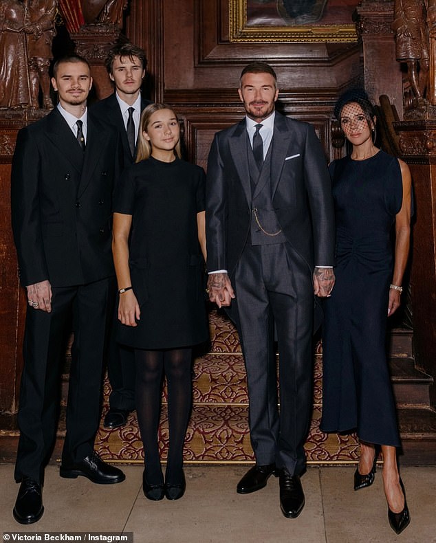 The Beckham clan are reportedly feeling their estranged son Brooklyn's absence harder than ever as Christmas looms (pictured last month at the reception following David's knighthood)