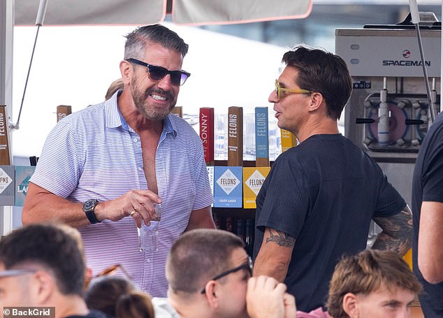 Bear, 62, looked stylish in a buttoned shirt, navy shorts and matching coloured sneakers