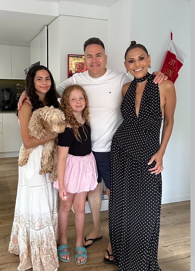 Sally Obermeder (right) also shared a heartwarming Christmas family snap, posing proudly with her loved ones inside her home