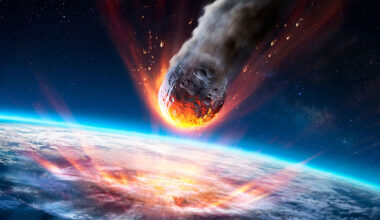an illustration shows a glowing asteroid hurtling toward the surface of a planet