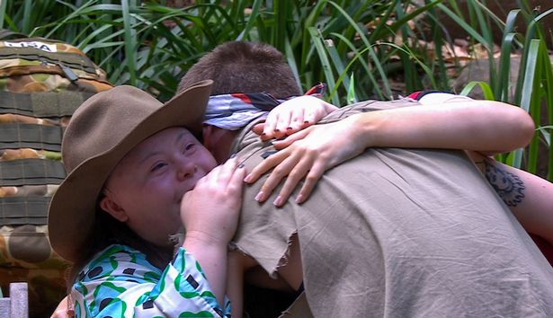 Aitch wrapped his arms around his little sisters