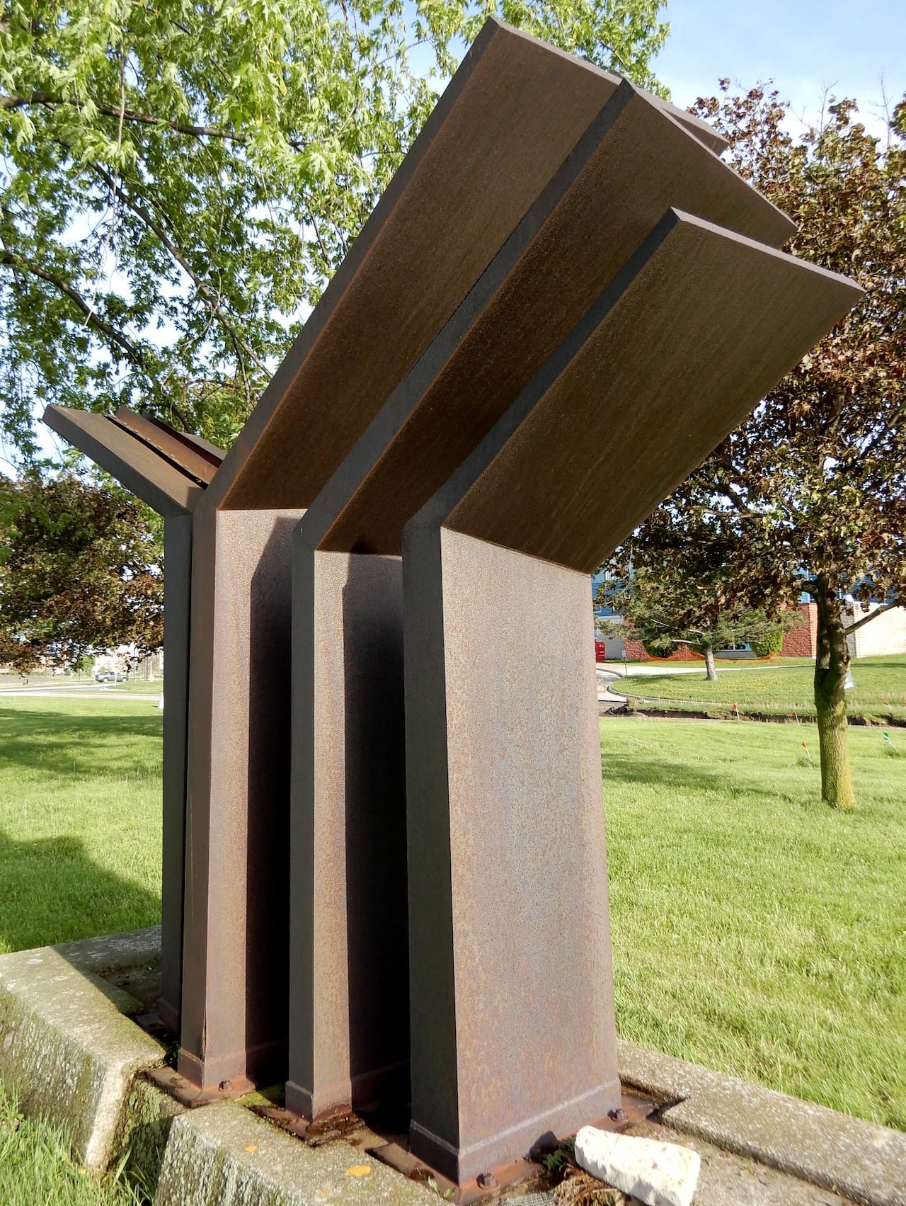 A slightly rusty metal abstract sculpture.