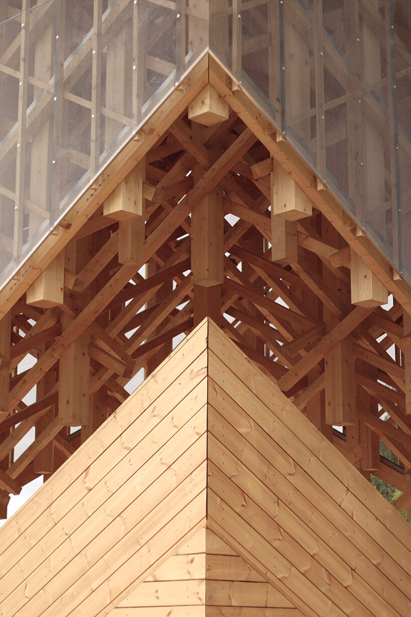 crystalline timber canopy inspired by snow fractals becomes a gathering space in finland