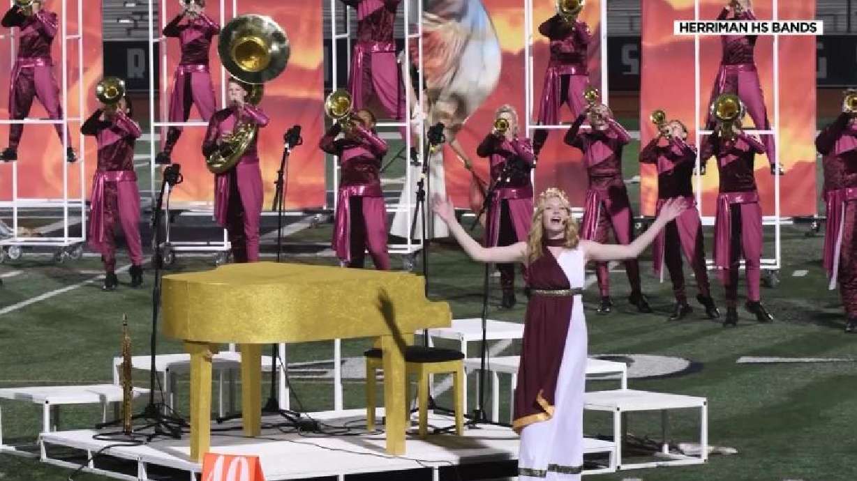 Musician surprises Herriman High School marching band while on tour