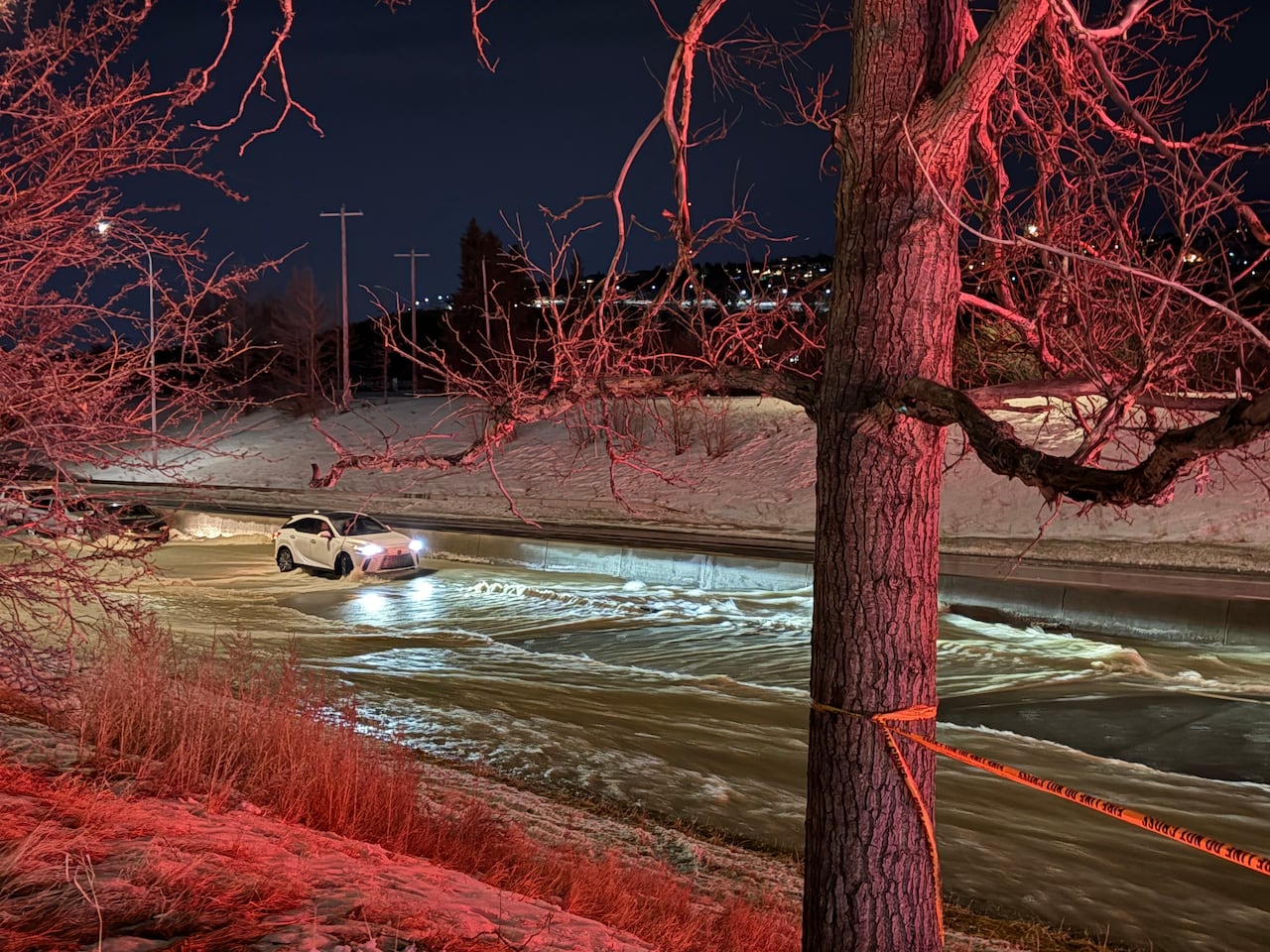 Flooding in northwest Calgary on Tuesday resulted in the Calgary Fire Department searching seven cars to rescue 13 people.