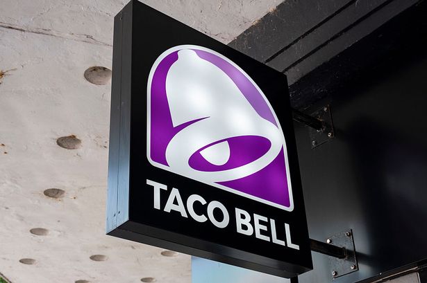 Sign for the fast food brand Taco Bell in the city centre on 27th June 2025 in Swansea, Wales, United Kingdom. Taco Bell is an American-based chain of fast food restaurants founded in 1962 by Glen Bell. The city centre, while remaining a retail hub for Swansea, has low employment in comparison to other cities, resulting in less money being spent and compounding the slow decline of high street shopping and economic prosperity in the area. (photo by Mike Kemp/In Pictures via Getty Images)