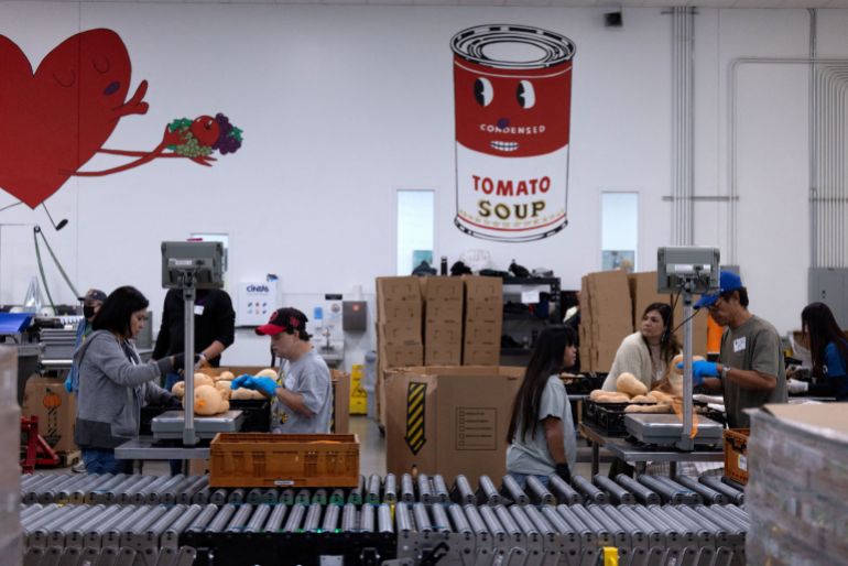 A food bank in Texas, with a picture of a Campbell soup can on the wall