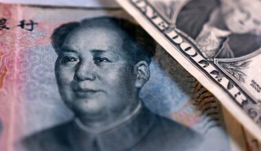 China state-owned banks soak up dollars to slow yuan gains, sources say