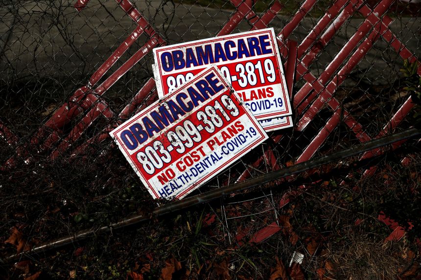 Signs for former Obamacare health insurance plans are seen in Columbia, South Carolina, on January 28, 2023.
