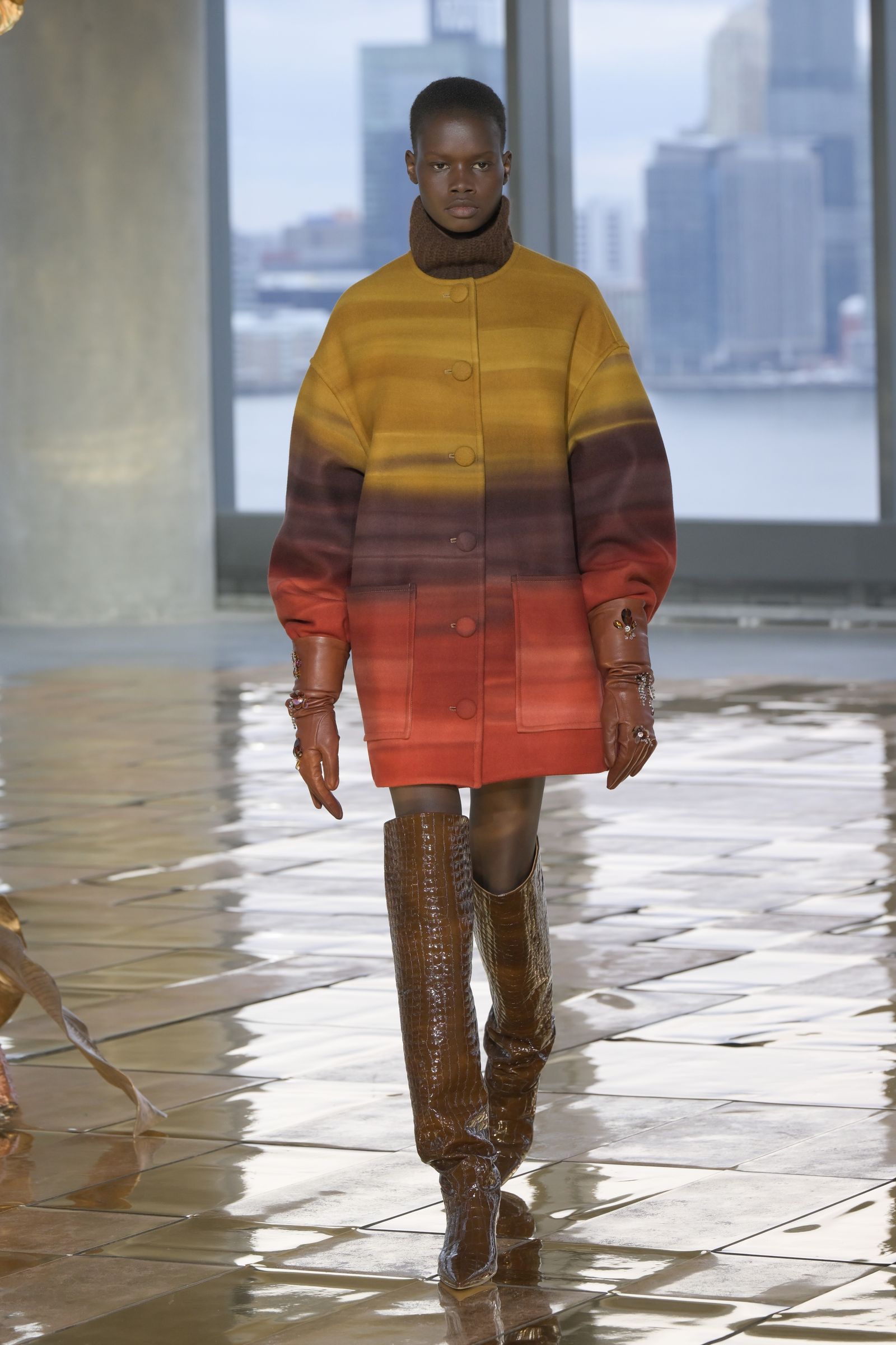 Image may contain Person Standing Adult Clothing and Coat