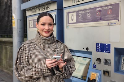 Gwenaelle Ní Dhonnabhain at a ticket-vending machine as Luas Green Line services remained suspended. Photograph: Dara Mac Dónaill