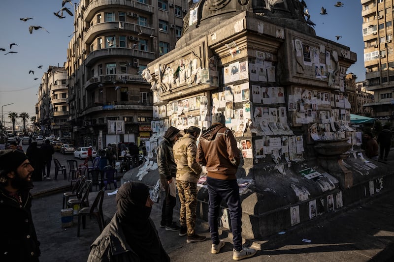Posters of missing people after the fall of the Assad government in Damascus, January 2025.  Photograph: David Guttenfelder/The New York Times
                      