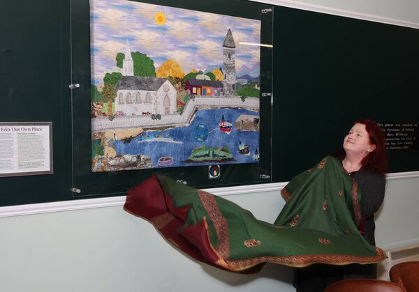 Mary Butler, who is the new chairperson of Killala Community Council Newstart CLG, unveils the quilt. 