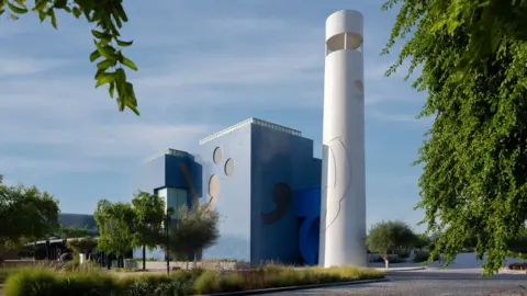 Qatar Foundation The white cylyndrical tower and blue-grey building of the Lawh Wa Qalam is seen at a distance 