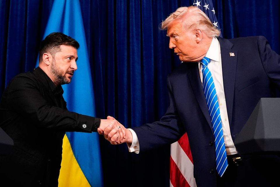 US president Donald Trump and Ukraine's president Volodymyr Zelensky shake hands at the start of a joint news conference following a meeting at Trump's Mar-a-Lago club, in Palm Beach. Photo: AP