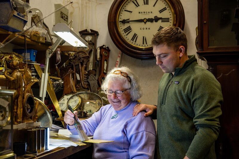 Sally Stokes prepares the two-foot-high clock numbers for the Shandon clock restoration as her grandson Robin Stokes looks on. Picture: Chani Anderson