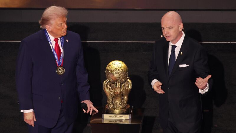 US President Donald Trump is presented with the inaugural FIFA Peace Prize award by FIFA President Gianni Infantino.