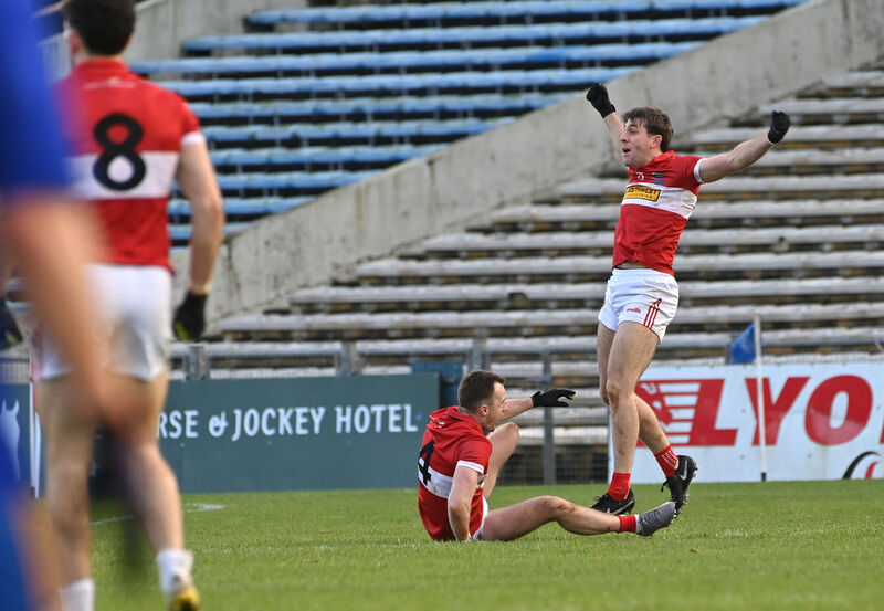  Dingle's Tom O'Sullivan with Conor Geaney who celebrates after scoring from a two-point free in added time against St Finbarr's. Picture: Dan Linehan